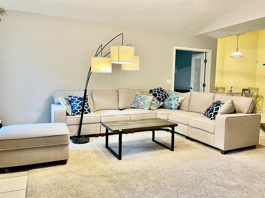 5164 Southwest 82 Terrace Gainesville, FL 32608 - Photo 10 of 25 a living room with furniture and a potted plant