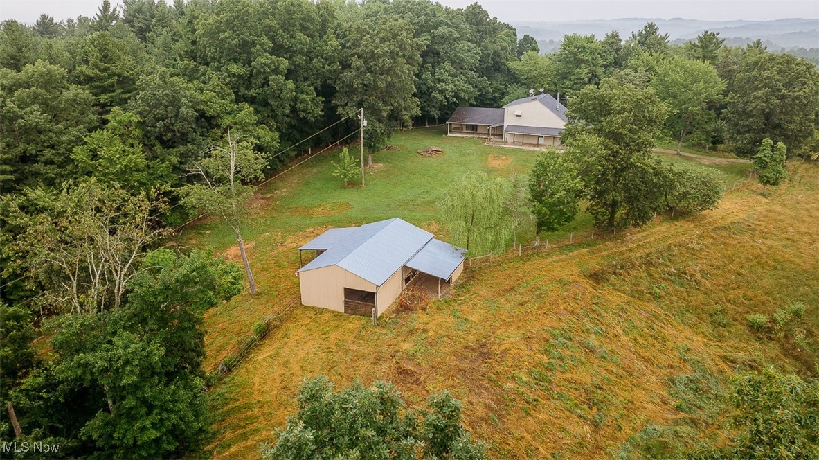 82755 Laughlin Road Tippecanoe, OH 44699 - Photo 5 of 35 View from above of property with a heavily wooded area