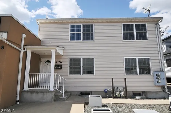 a front view of a house with a porch