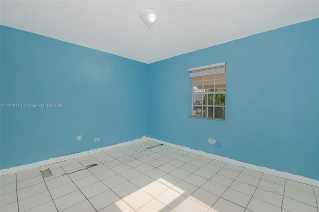 a view of an empty room with window