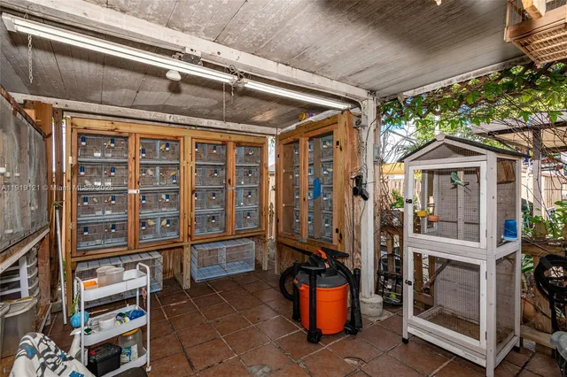 a view of backyard with wheel chair and potted plants