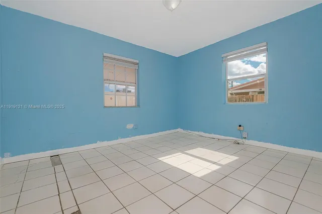 a view of an empty room and window