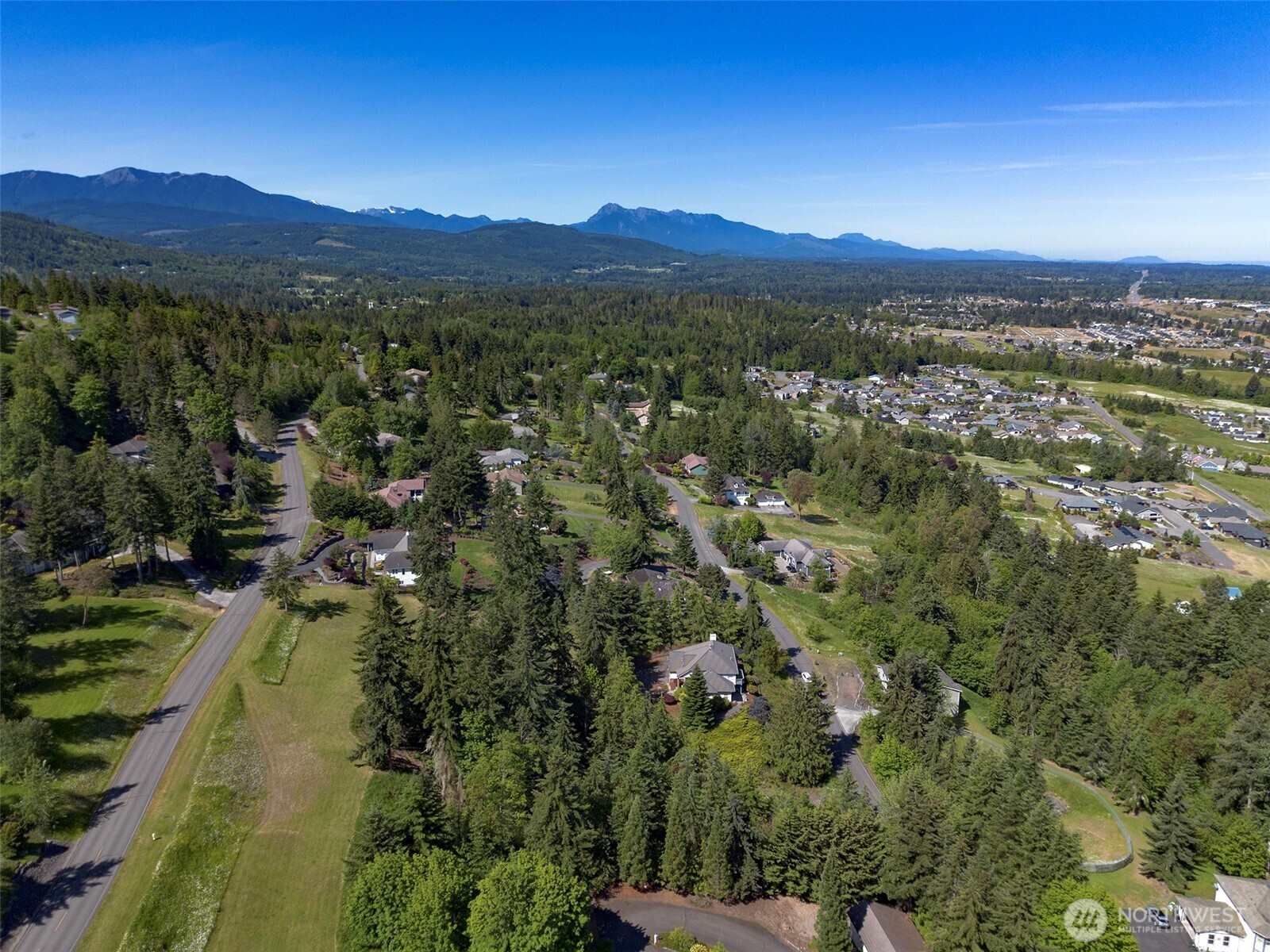 -nka Owls Nest Road Sequim, WA 98382 - Photo 31 of 38 a view of a city with mountains in the background
