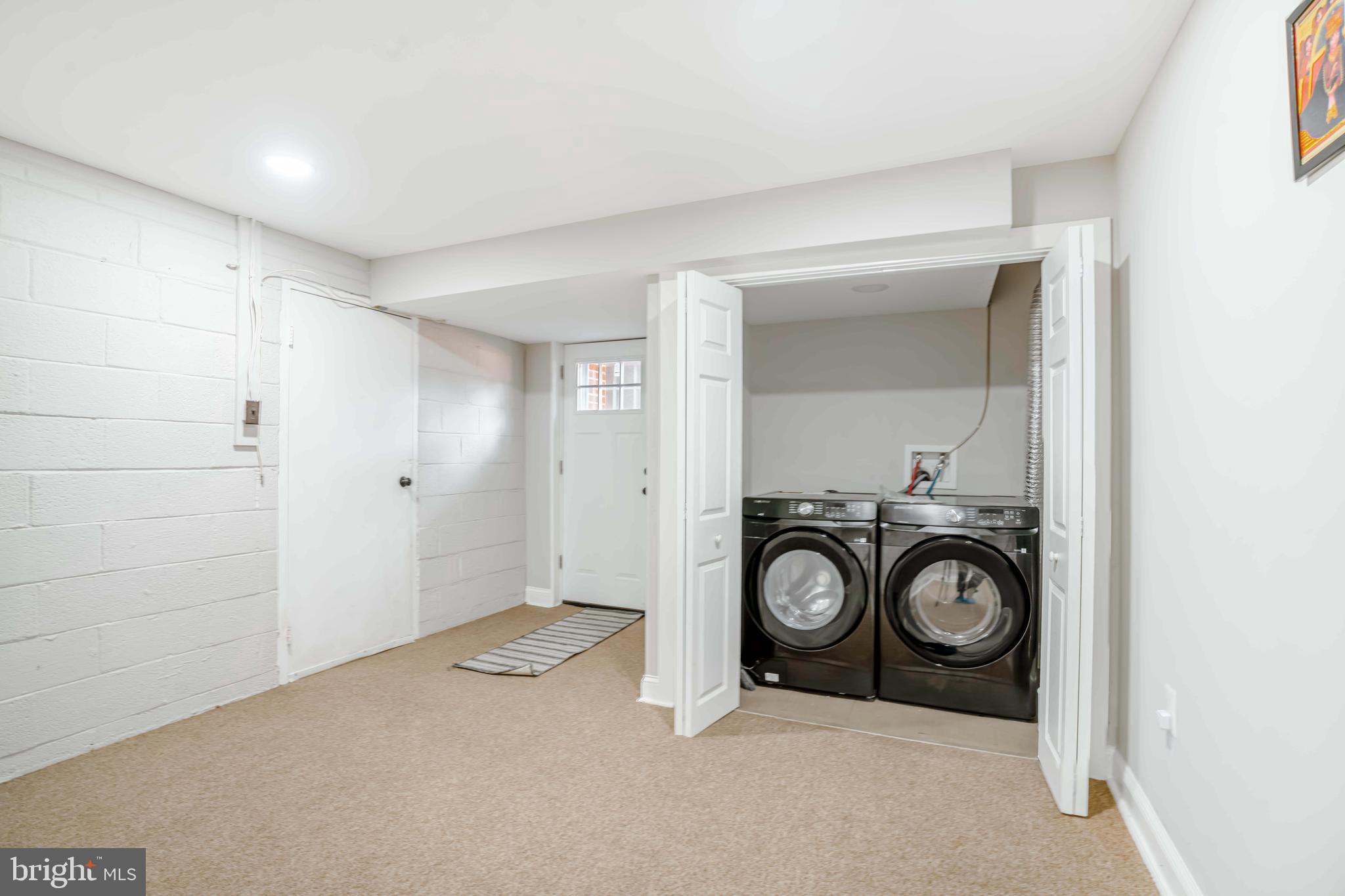 923 Ray Road Hyattsville, MD 20783 - Photo 23 of 32 a view of a storage & utility room with a washer dryer