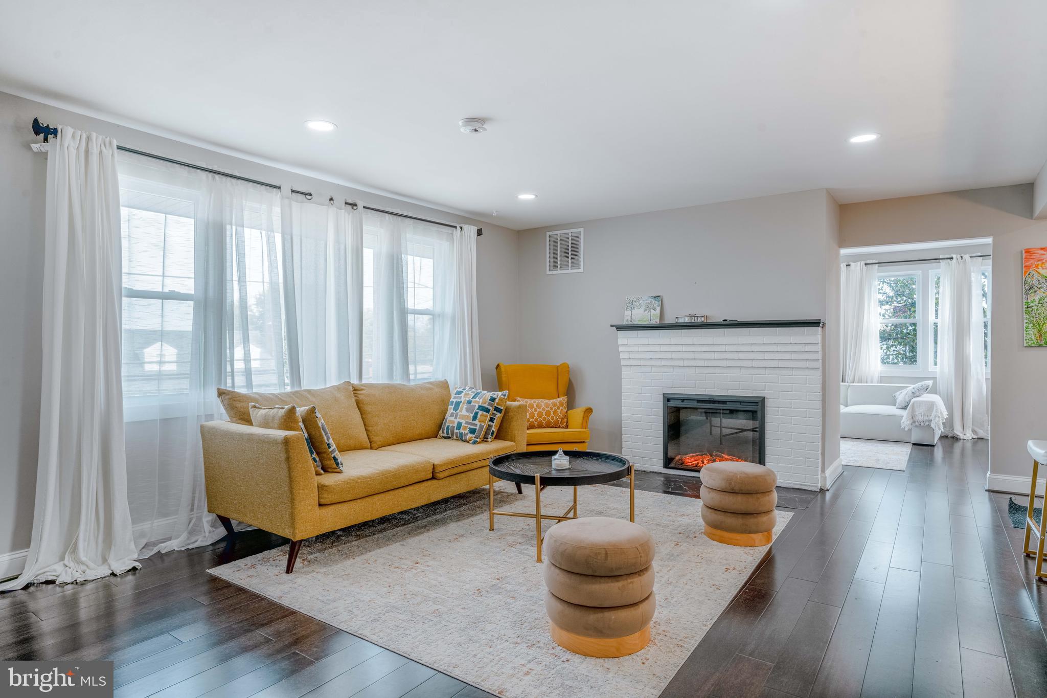 923 Ray Road Hyattsville, MD 20783 - Photo 5 of 32 a living room with furniture and a fireplace