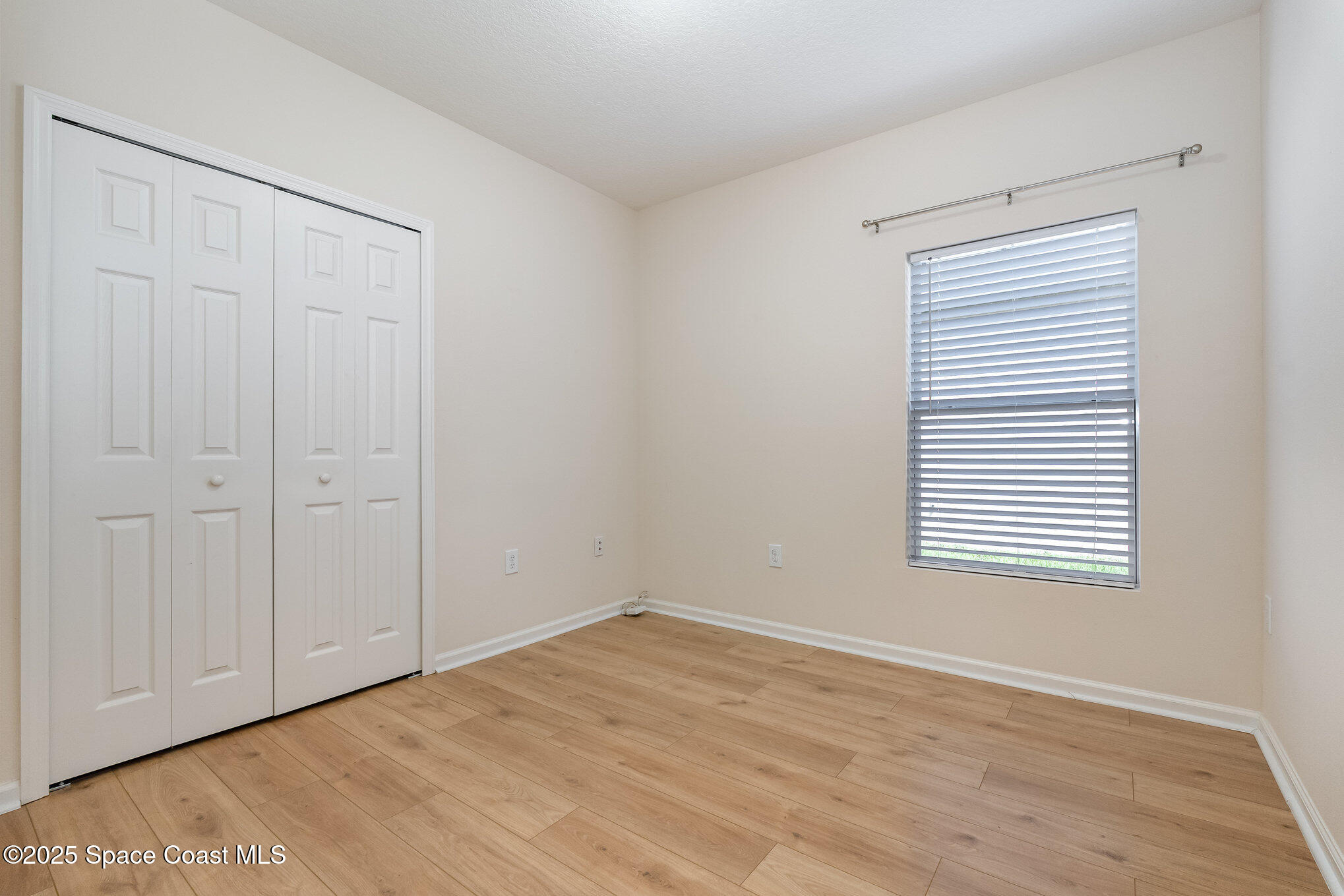 1517 Attilburgh Boulevard Melbourne, FL 32904 - Photo 11 of 15 wooden floor in an empty room
