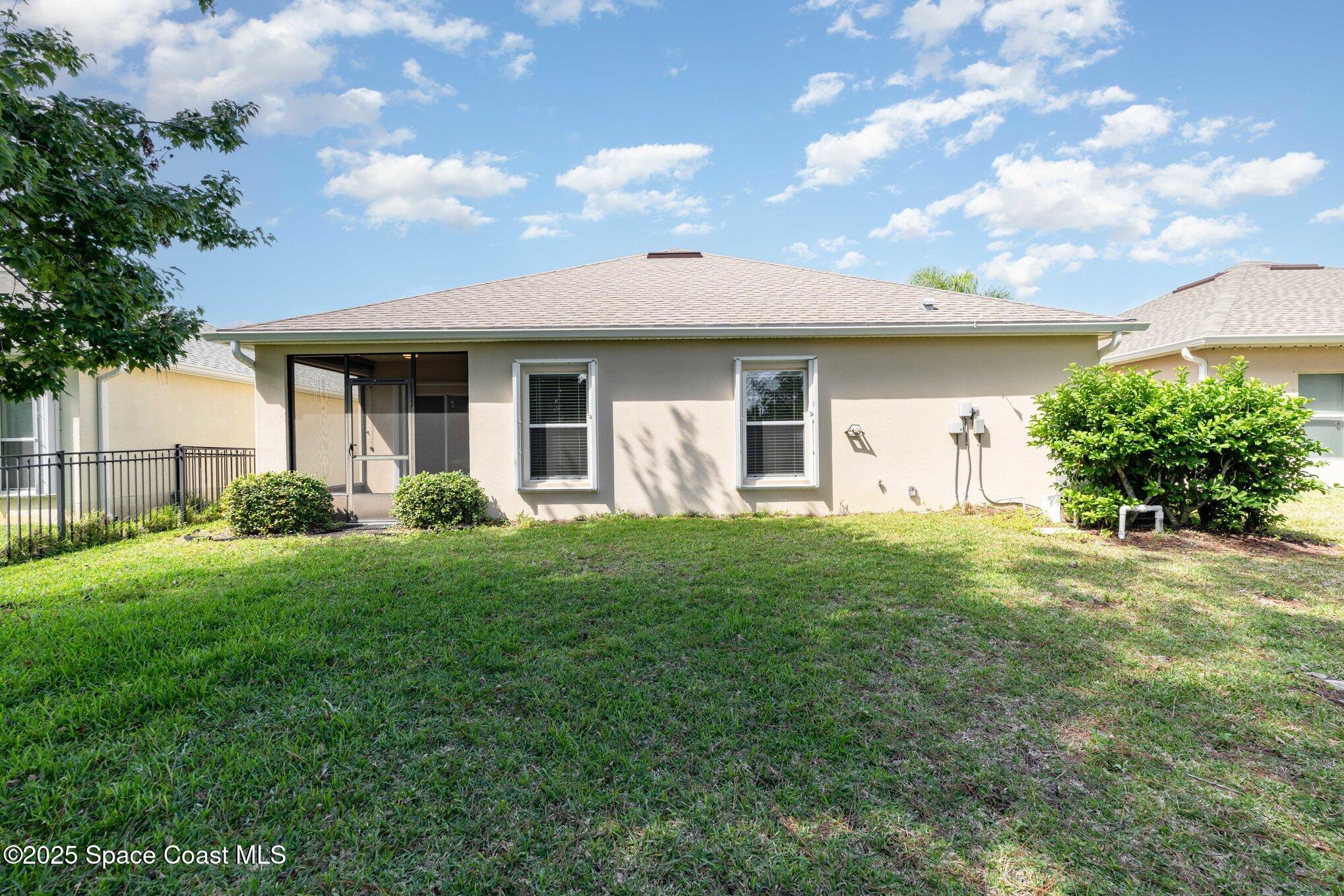 1517 Attilburgh Boulevard Melbourne, FL 32904 - Photo 15 of 15 a view of a house with yard and a garden