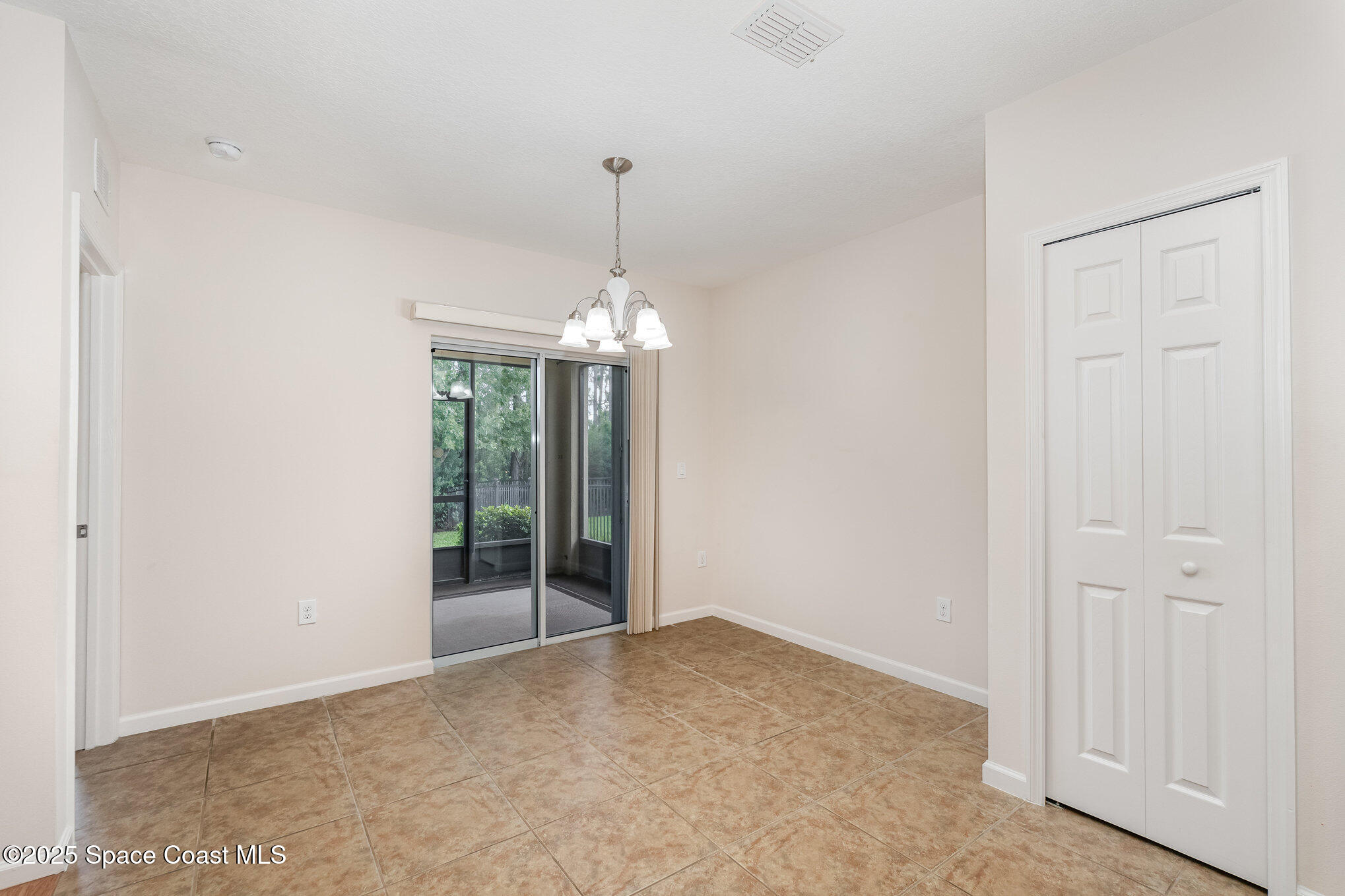 1517 Attilburgh Boulevard Melbourne, FL 32904 - Photo 3 of 15 a view of a chandelier in an empty room