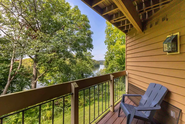a view of a balcony with chairs