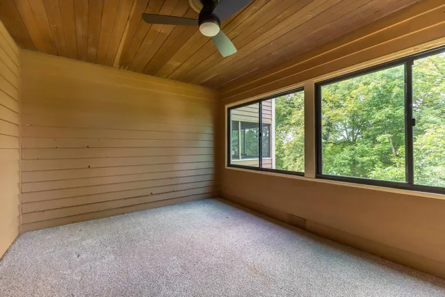 a view of a room with a large window