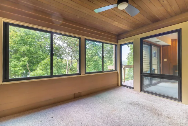 a view of an empty room with a balcony