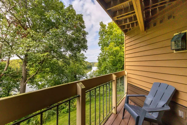 a view of a chair and table in the balcony