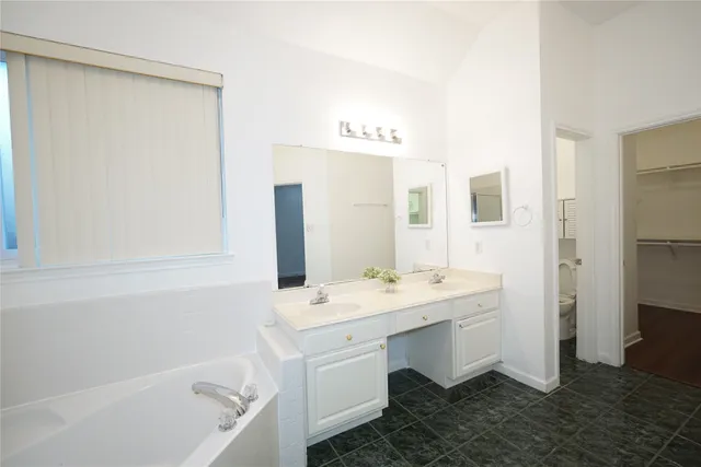 a bathroom with a sink and a bathtub