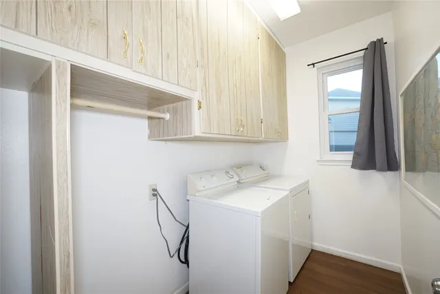 a utility room with a sink dryer and washer