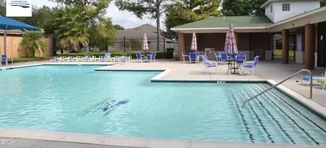 a view of pool with outdoor seating