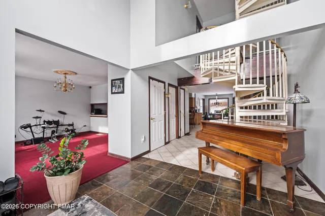 a lobby with furniture and flowers