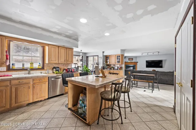 a kitchen with appliances cabinets and a counter top space