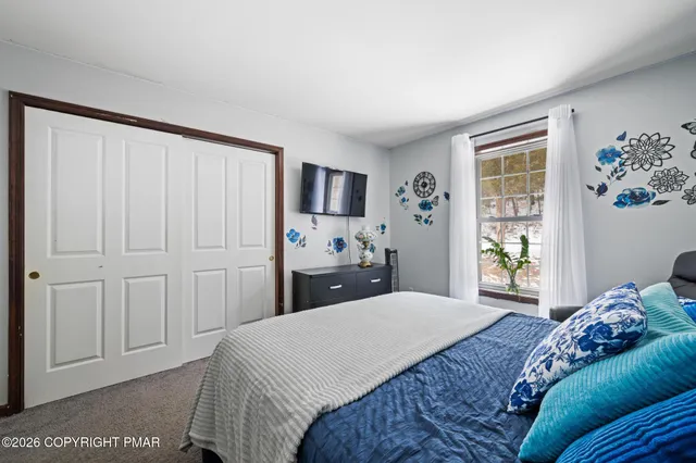 a bathroom with a sink a vanity and a large mirror