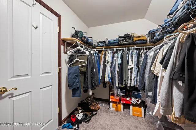 a view of a yard covered with snow in front of house
