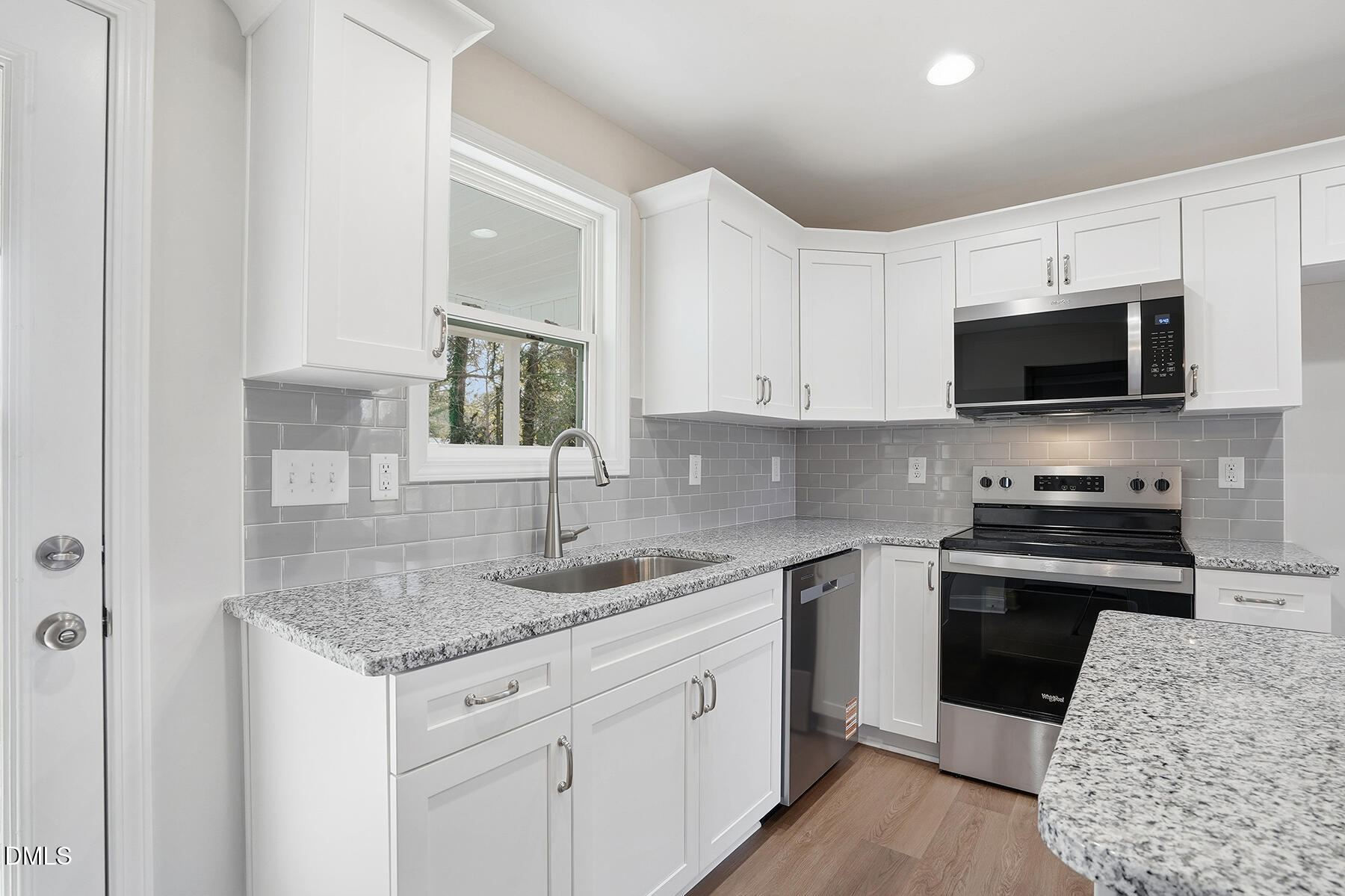 214 Rae Street Warsaw, NC 28398 - Photo 15 of 28 a kitchen with stainless steel appliances granite countertop a sink stove and microwave