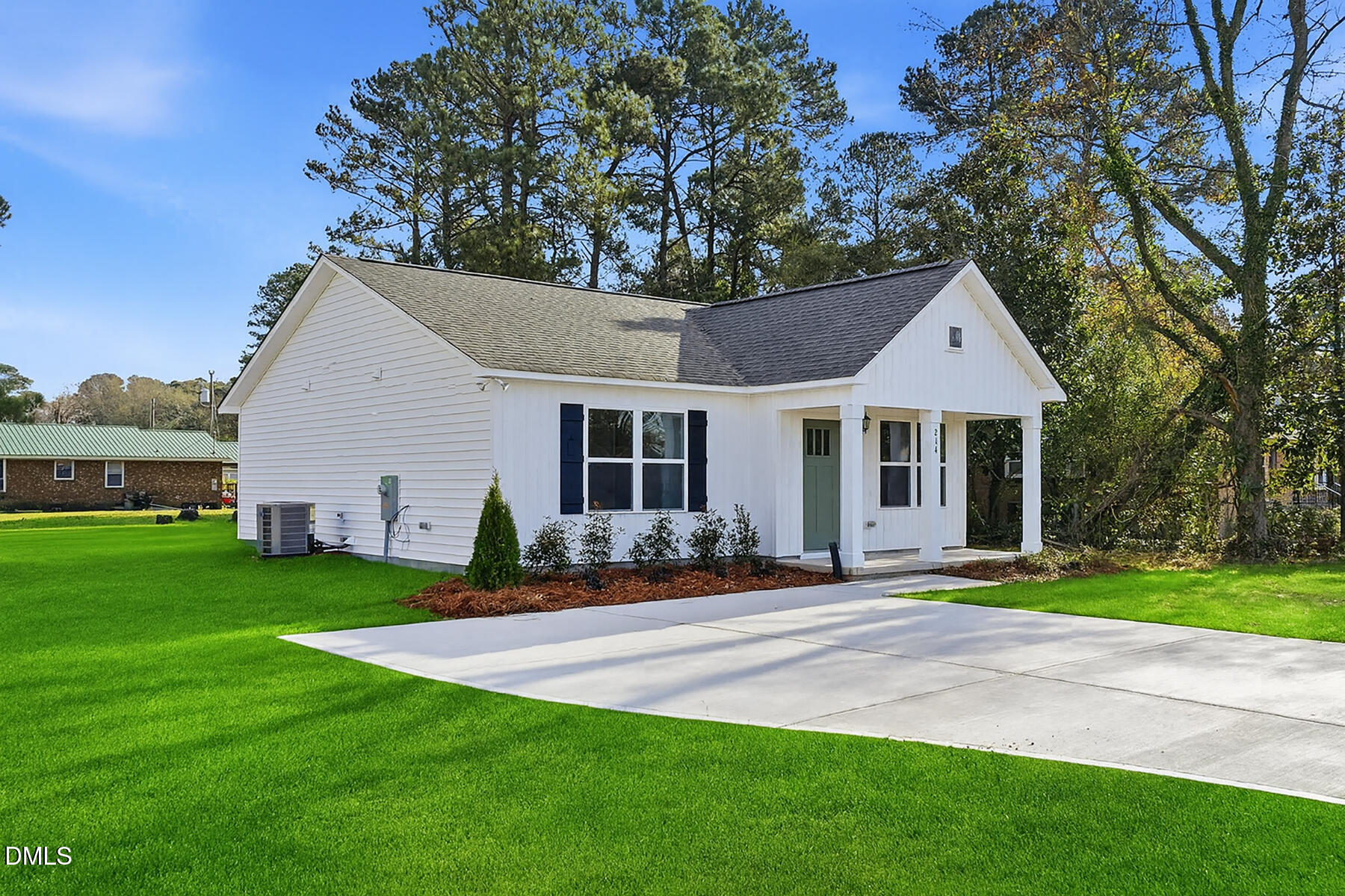 214 Rae Street Warsaw, NC 28398 - Photo 2 of 28 a front view of a house with a yard and trees