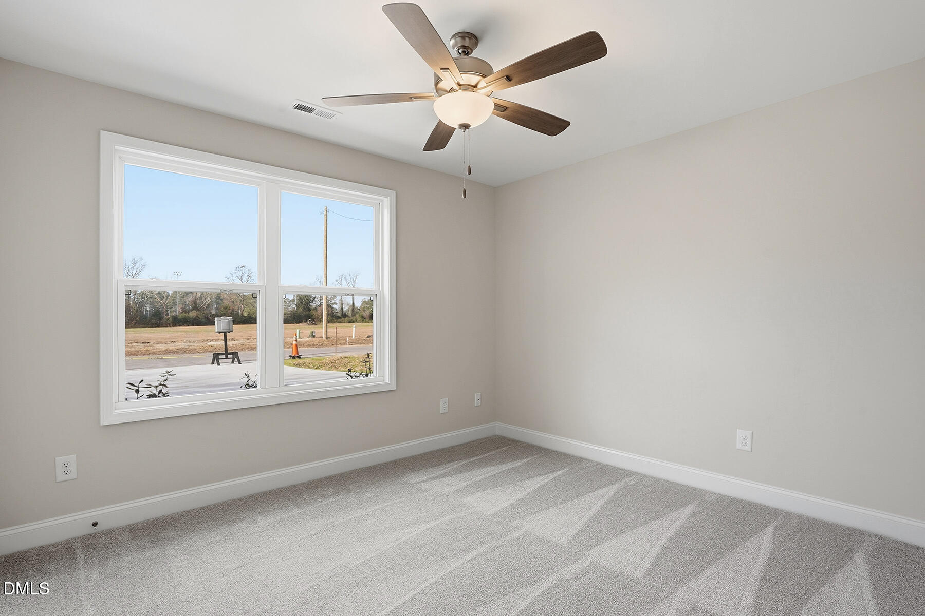 214 Rae Street Warsaw, NC 28398 - Photo 21 of 28 an empty room with a window and a ceiling fan