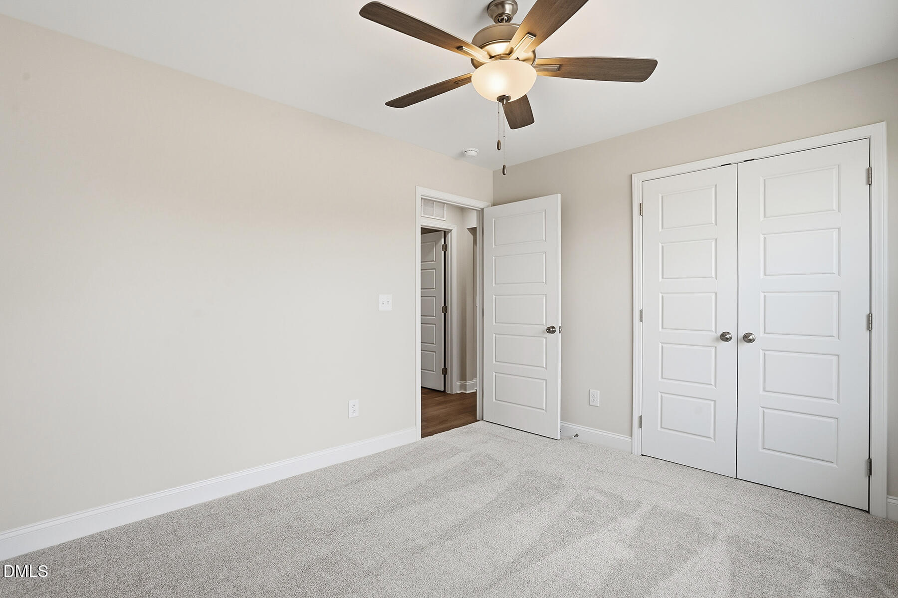 214 Rae Street Warsaw, NC 28398 - Photo 22 of 28 an empty room with closet and a chandelier fan