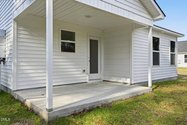 a view of a house with backyard and a window
