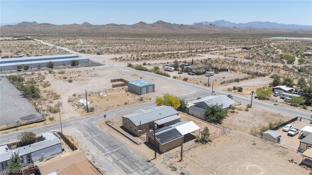 225 California Street Searchlight, NV 89046 - Photo 60 of 64 A vast, open desert landscape provides a serene backdrop for this secluded property.