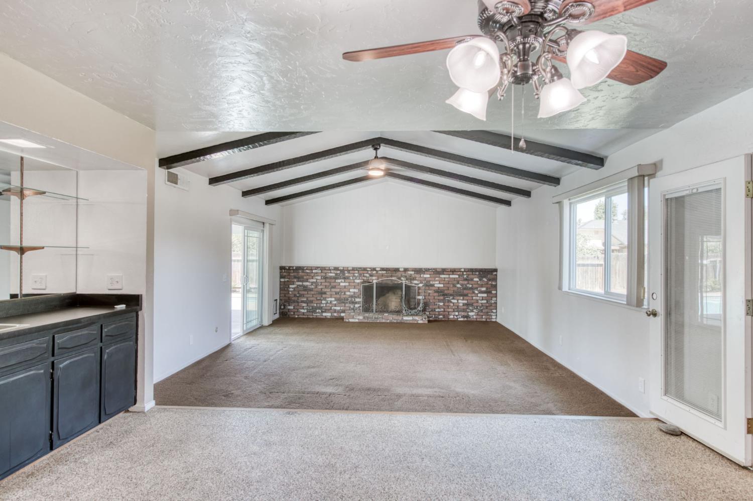 1580 Armstrong Avenue Clovis, CA 93611 - Photo 12 of 50 a view of a livingroom with a ceiling fan and chandelier