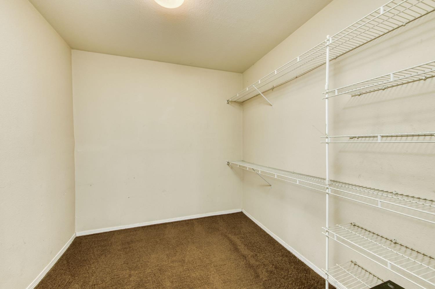 1580 Armstrong Avenue Clovis, CA 93611 - Photo 18 of 50 a view of an empty walk in closet