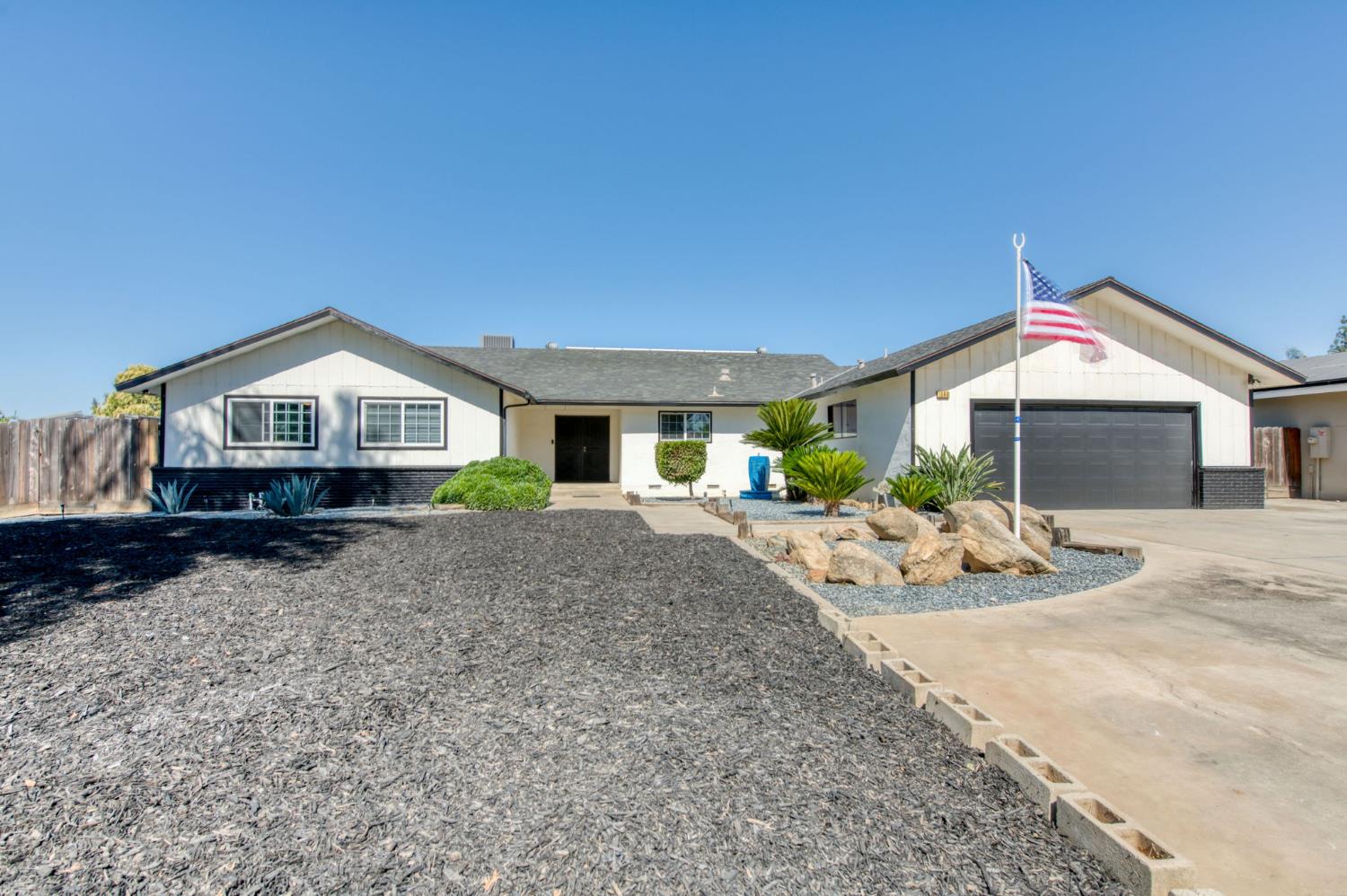 1580 Armstrong Avenue Clovis, CA 93611 - Photo 2 of 50 a front view of a house with yard and wooden fence