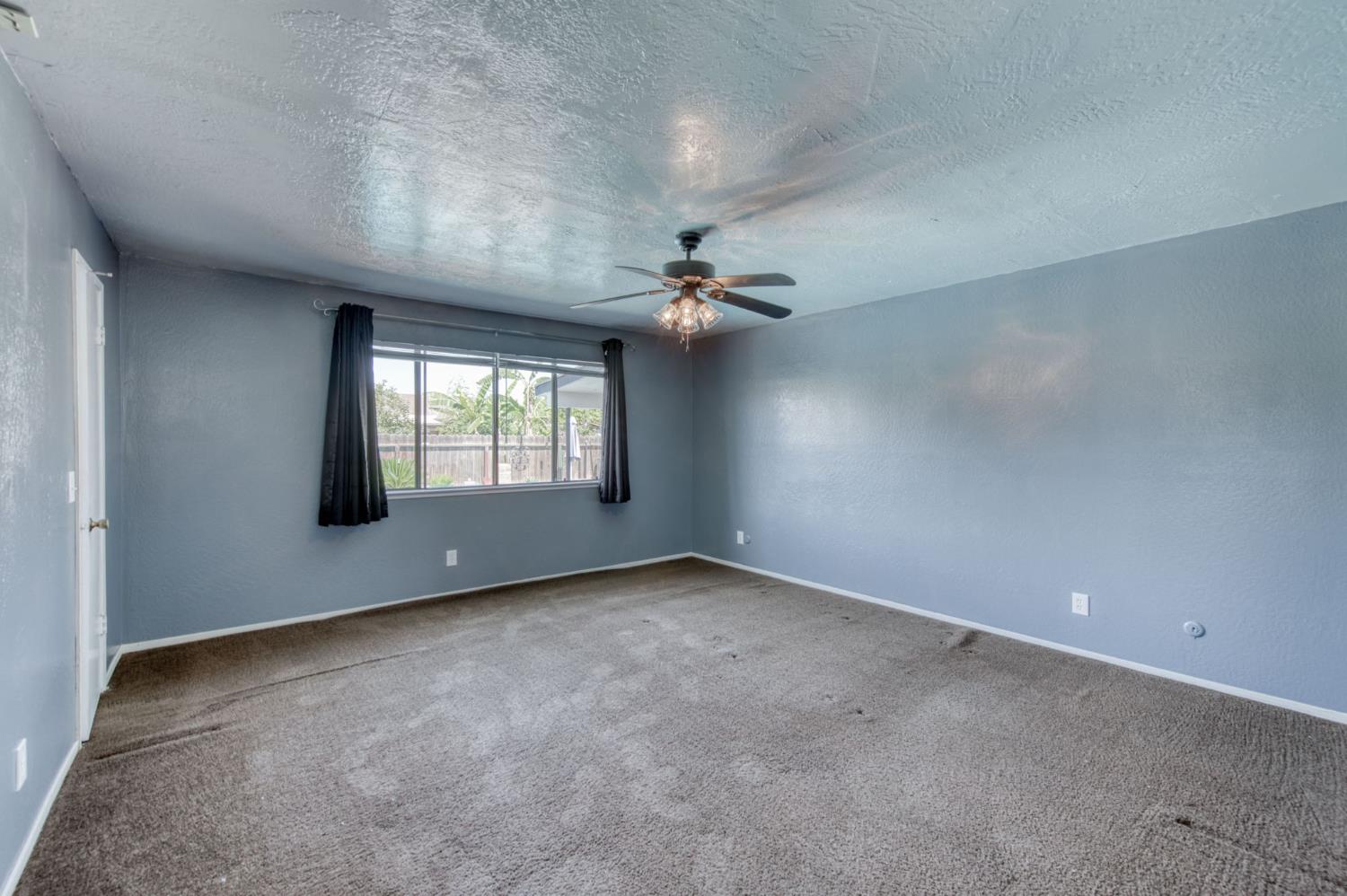 1580 Armstrong Avenue Clovis, CA 93611 - Photo 21 of 50 wooden floor in an empty room with a window