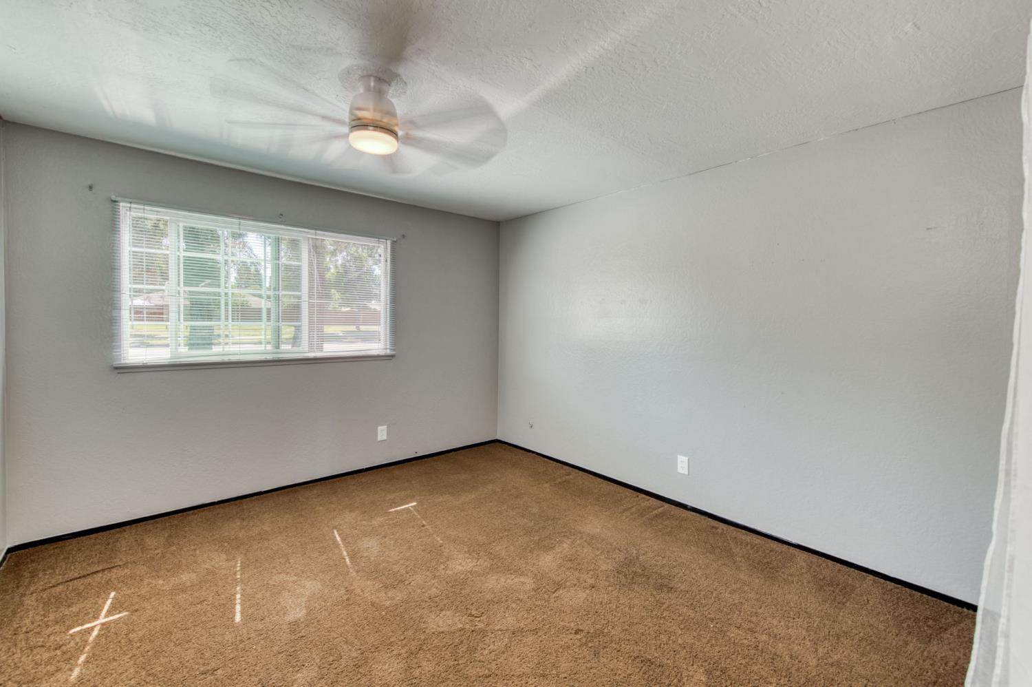 1580 Armstrong Avenue Clovis, CA 93611 - Photo 25 of 50 an empty room with a window