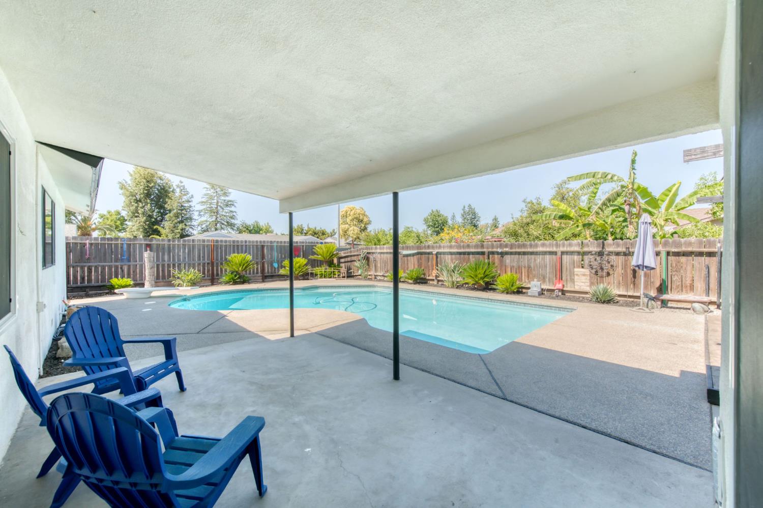 1580 Armstrong Avenue Clovis, CA 93611 - Photo 30 of 50 a view of a porch with furniture and a yard