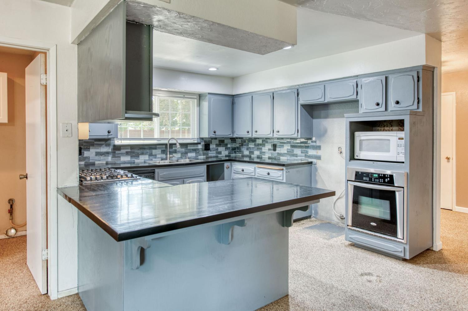 1580 Armstrong Avenue Clovis, CA 93611 - Photo 3 of 50 a kitchen with stainless steel appliances granite countertop a sink stove and refrigerator