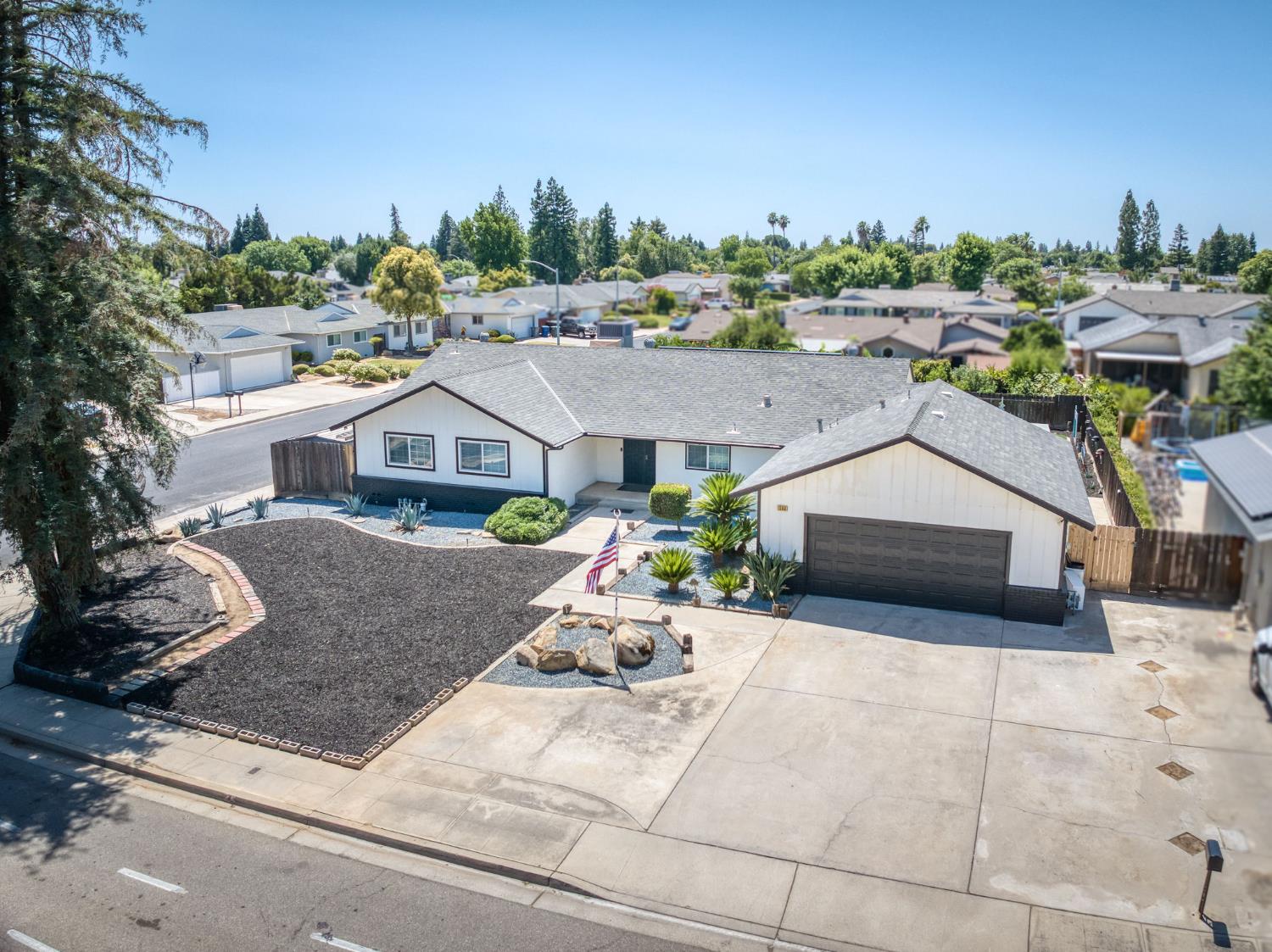 1580 Armstrong Avenue Clovis, CA 93611 - Photo 43 of 50 a aerial view of a house with a yard and potted plants