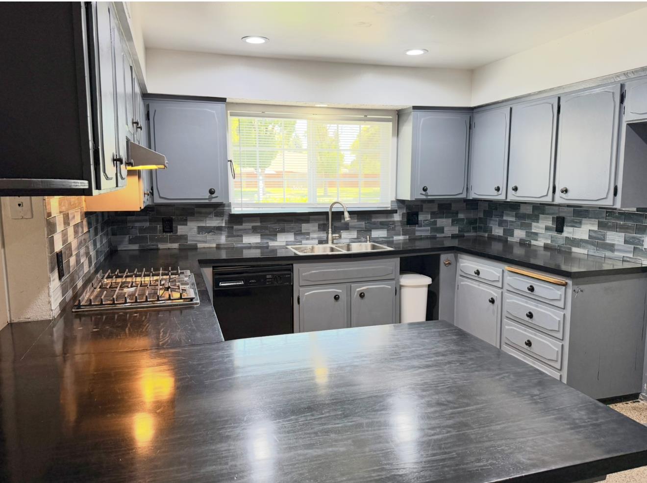 1580 Armstrong Avenue Clovis, CA 93611 - Photo 5 of 50 a kitchen with stainless steel appliances granite countertop wooden cabinets stove and sink