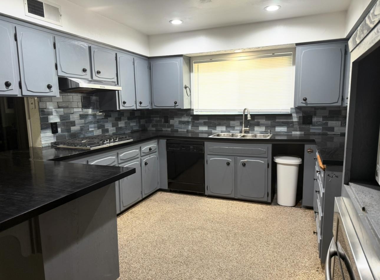 1580 Armstrong Avenue Clovis, CA 93611 - Photo 6 of 50 a kitchen with stainless steel appliances granite countertop a stove a sink and a refrigerator