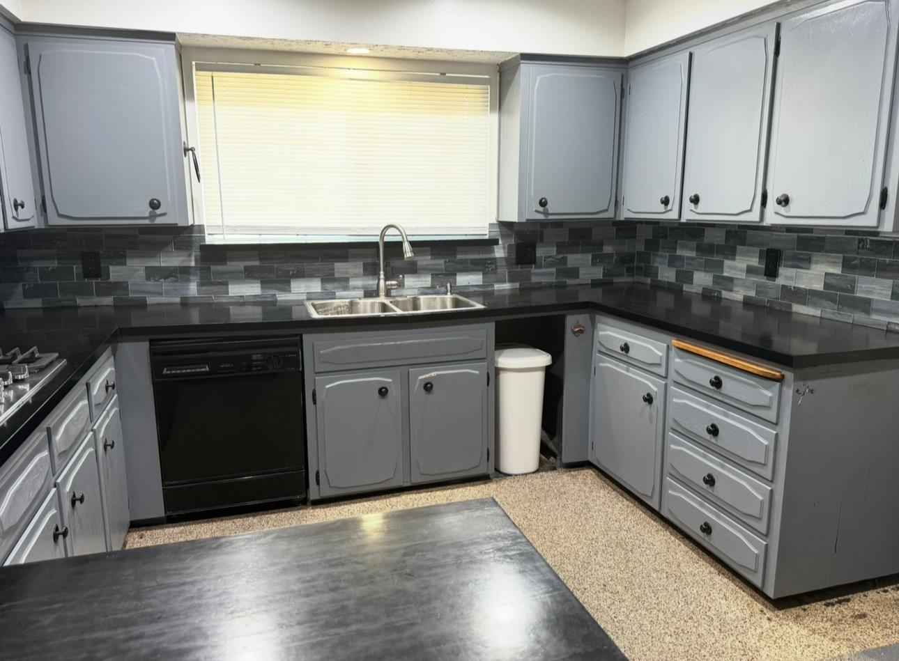 1580 Armstrong Avenue Clovis, CA 93611 - Photo 8 of 50 a kitchen with stainless steel appliances granite countertop a sink and cabinets
