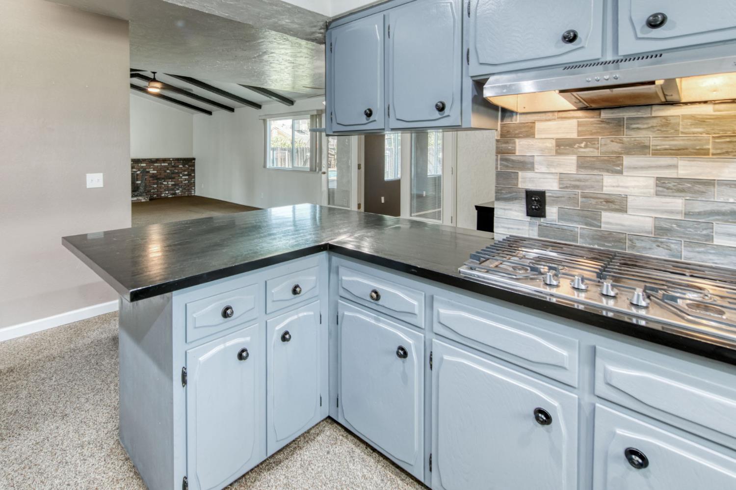 1580 Armstrong Avenue Clovis, CA 93611 - Photo 9 of 50 a kitchen with granite countertop a sink stainless steel appliances and cabinets