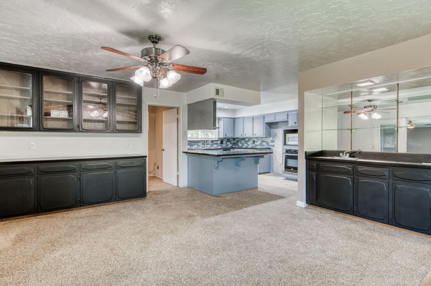 1580 Armstrong Avenue Clovis, CA 93611 - Photo 10 of 50 a kitchen with stainless steel appliances granite countertop a refrigerator a sink dishwasher with a stove and cabinets
