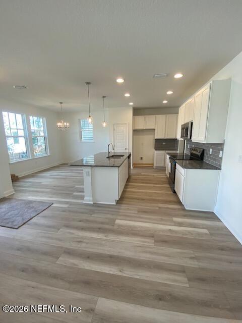 2913 Fleur Lane Jacksonville, FL 32205 - Photo 2 of 3 a view of kitchen with kitchen island wooden cabinets and refrigerator