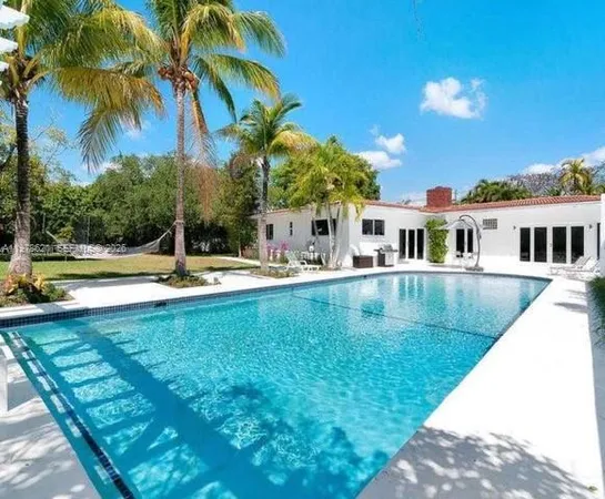 a view of a house with a swimming pool