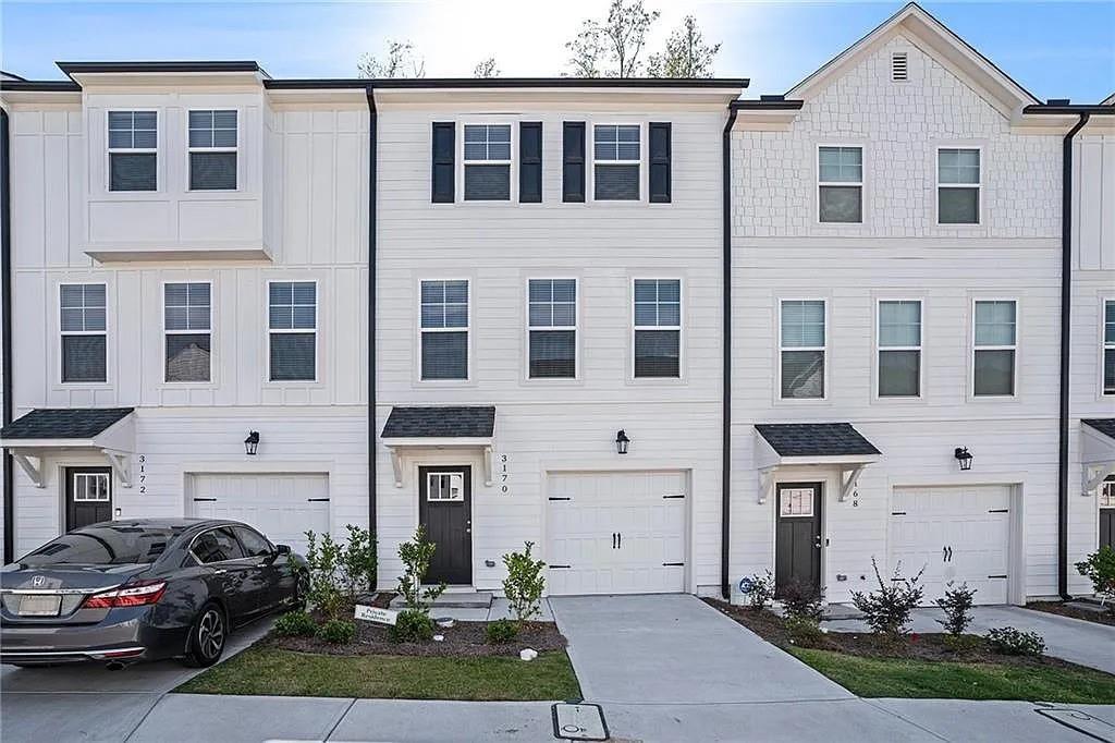 a view of a car parked in front of a brick building