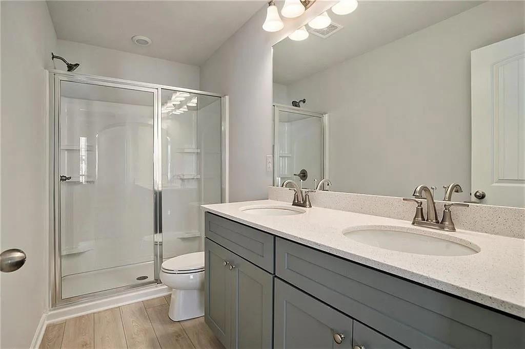 3132 Washburn Street Southeast Atlanta, GA 30354 - Photo 5 of 10 a bathroom with a sink a toilet and shower