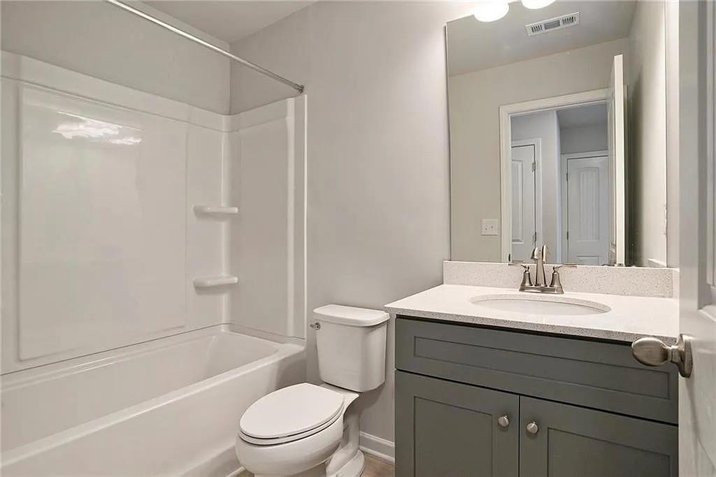 3132 Washburn Street Southeast Atlanta, GA 30354 - Photo 8 of 10 a bathroom with a sink a toilet and shower