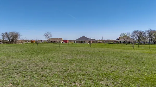 a view of a field with an outdoor space