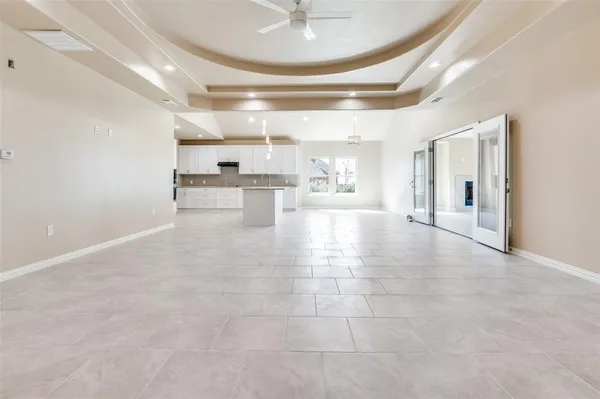 a view of a kitchen with a sink and cabinets