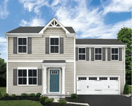 a front view of a house with garage